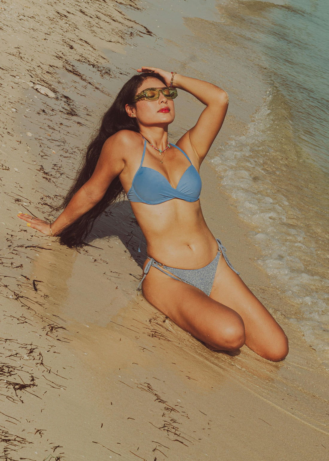 Woman wearing a comfortable minimalist bikini on the beach in 2026 — Vesyn